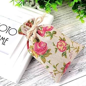 ถุงผ้าหูรูดลายดอกไม้ ขนาด10x14cm(แพ็ค25ชิ้น) : 006739