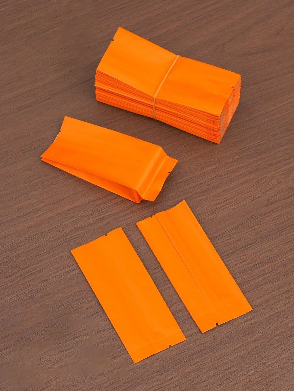 ถุงซองฟอยล์ซีลกลางขยายข้าง สีส้มเนื้อด้าน ขนาด 5.5x12+2.3cm แพ็ค100ชิ้น